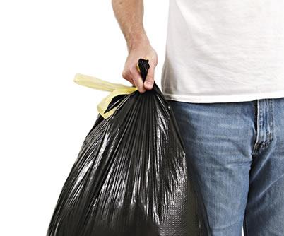 man holding trash