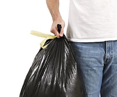 man holding a trash bag